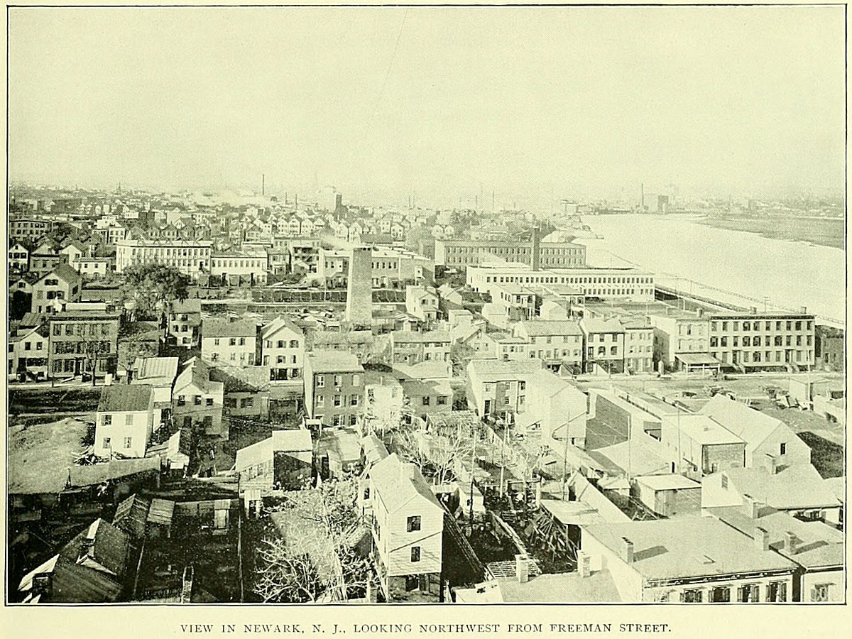 This photo was taken around 1897 and most likely from the roof of Feigenspan's Brewery on Freeman Street.  The view is to the west northwest.  The large chimney in the center of the photo is from the P. Reilly & Sons Tannery which was located between Providence & Lexington Streets.  The factory area extended from the Morris Canal south almost to Bowery Street (Fleming Avenue) which would be the middle of the photograph, left to right. The first street from the bottom running L to R is Oxford Street.

Photo from Essex County Illustrated 1897
